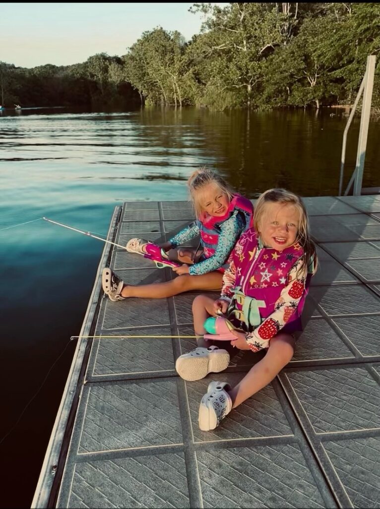 2 girls on deck fishing on Table Rock Lake