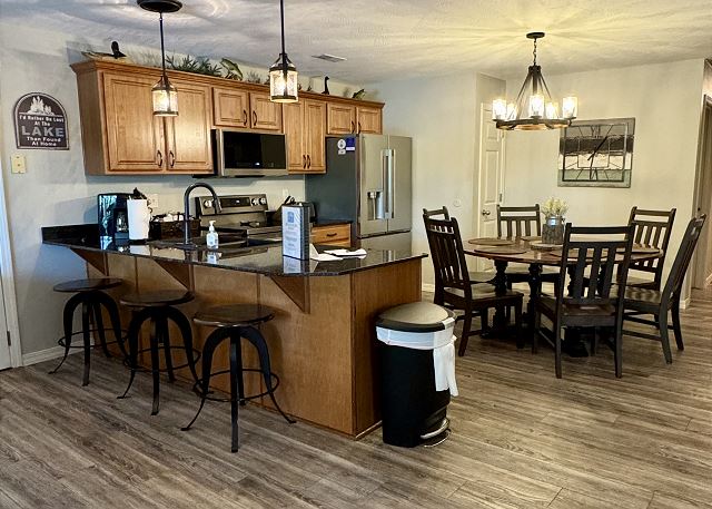 Full kitchen and breakfast bar in Condo A-1