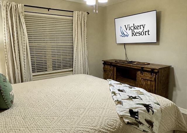 Guest bedroom with television in Condo A-1