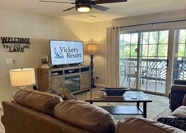 Comfortable living room with deck access inside Condo A-1 at Vickery Resort