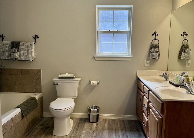 Primary bathroom with jetted tub in Condo A-1