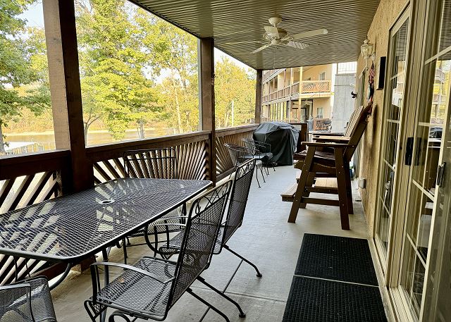 Covered deck dining and gas grill at Condo A-3