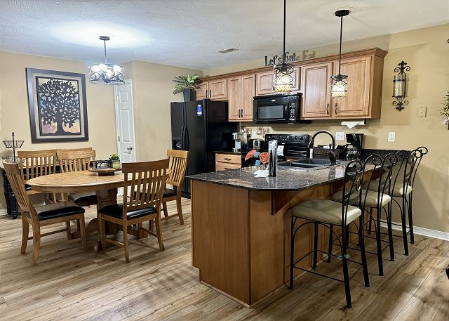 Granite kitchen and breakfast bar in Condo A-3