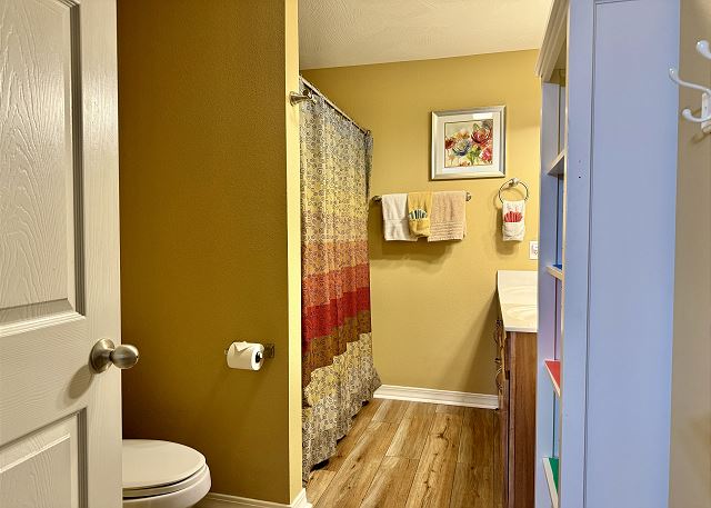 Guest bathroom with tub and shower in Condo A-3