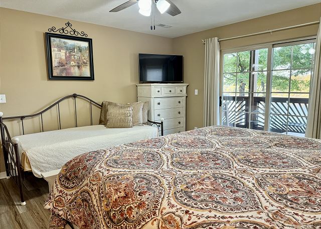 Third bedroom with queen and twin beds in Condo A-3