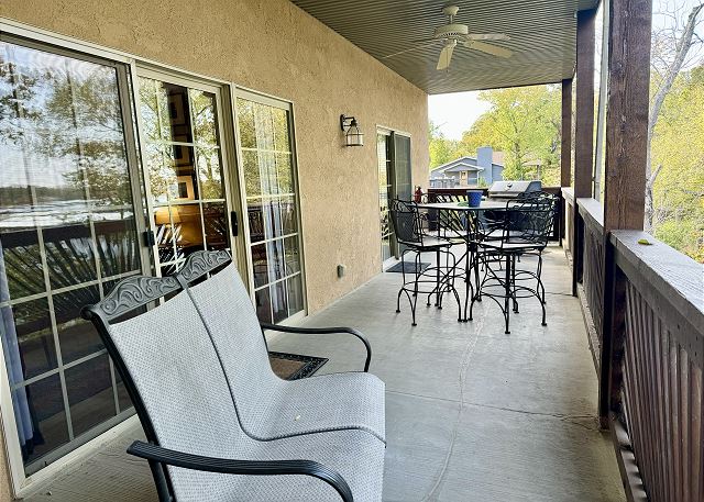 Covered deck dining and gas grill at Condo A-4