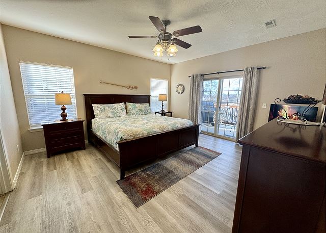 Primary king bedroom with deck access in Condo A-4