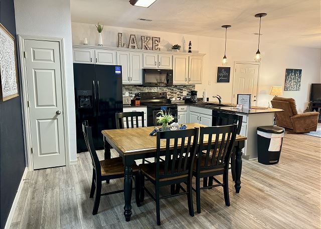 Full kitchen and dining table inside Condo A-5