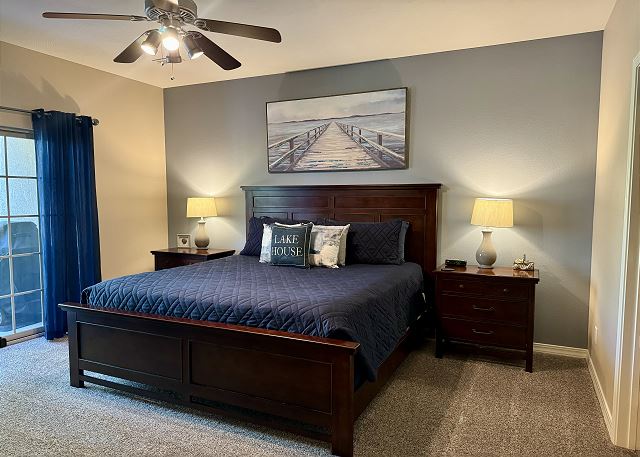 Primary king bedroom with private deck access in Condo A-5