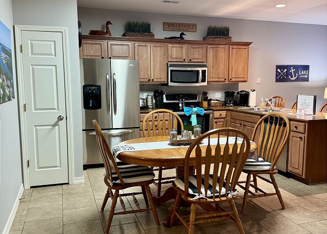 Full kitchen and dining table in Condo A-6