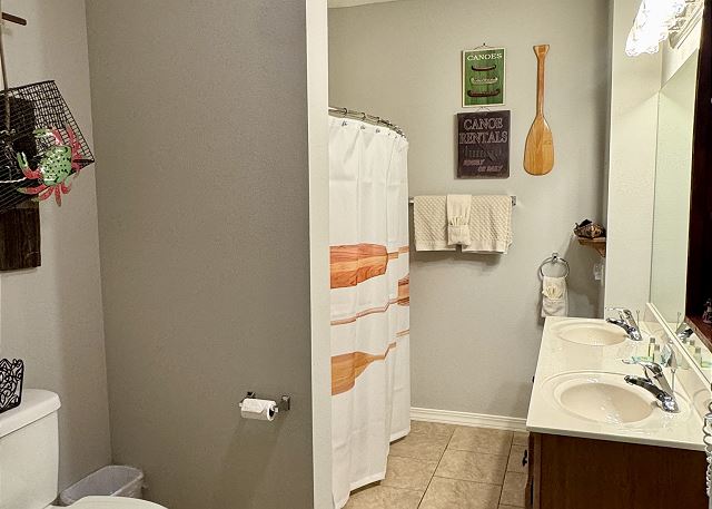 Guest bathroom with tub and shower in Condo A-6