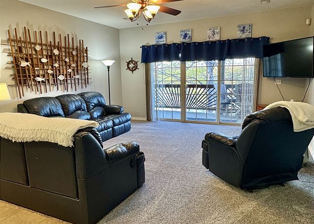 Living room and private balcony in Condo A-6