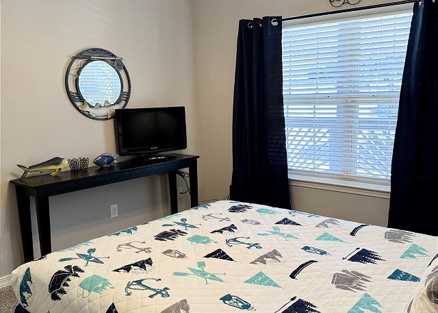 Second queen bedroom with television in Condo A-6