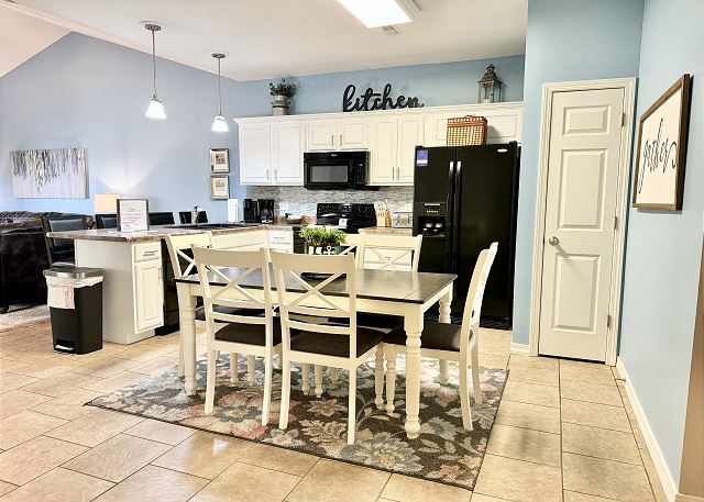 Full kitchen and dining table in Condo A-7