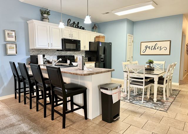 Kitchen breakfast bar seating in Condo A-7