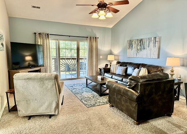 Living room and private balcony in Condo A-7