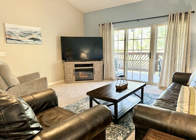 Living room entertainment area in Condo A-7