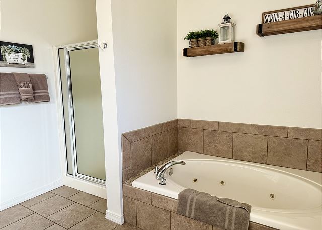 Primary bathroom walk-in shower in Condo A-7