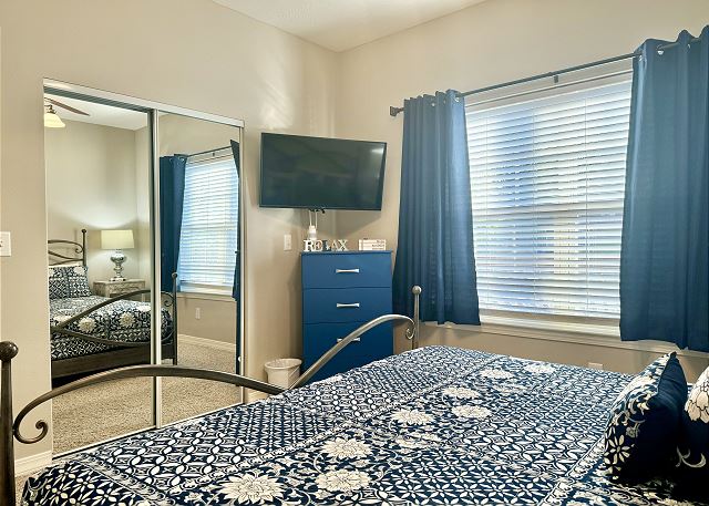 Second queen bedroom with television in Condo A-7