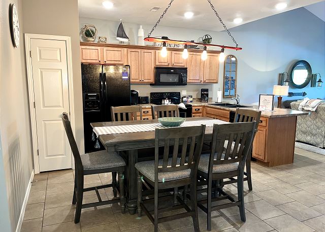 Full kitchen and dining table in Condo A-9
