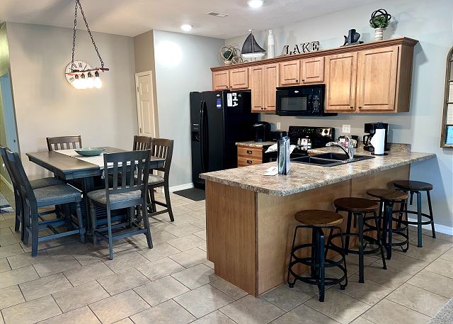 Kitchen breakfast bar and dining area in Condo A-9