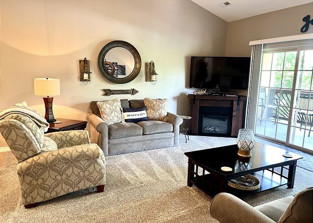 Living room fireplace and television in Condo A-9