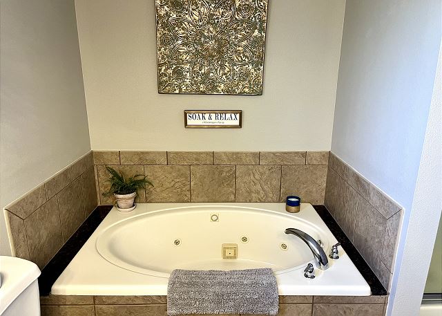 Jetted tub in the primary bathroom of Condo A-9