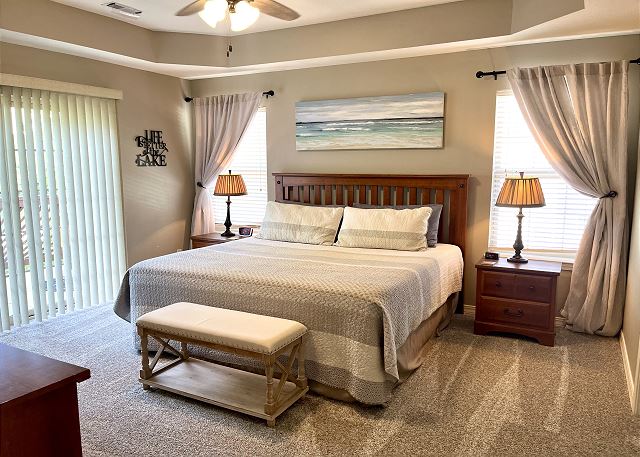 Primary king bedroom with deck access in Condo A-9