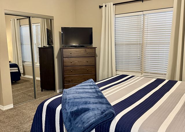 Guest king bedroom with TV