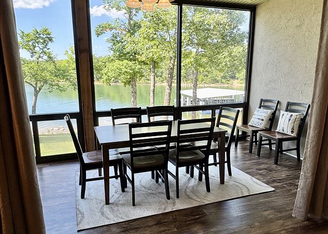 Screened patio dining and lake view