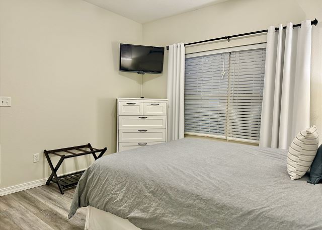 Second queen bedroom with TV