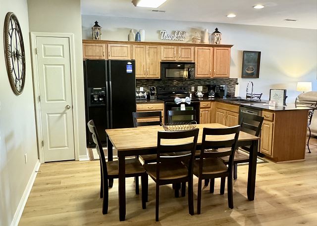 Full kitchen and dining area