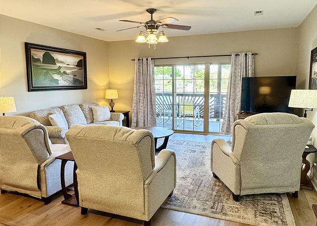 Living room opening to the private covered deck