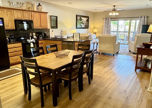 Open-concept kitchen dining and living area in Condo B-3