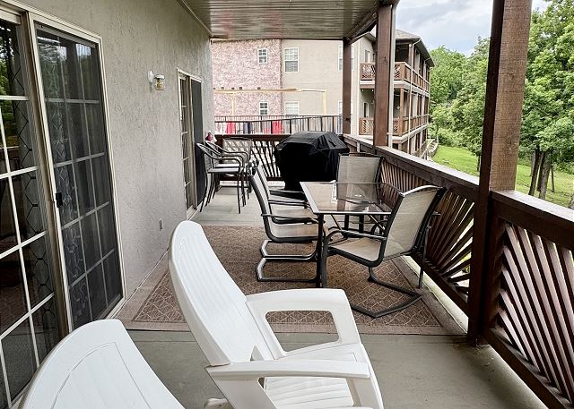 Covered deck dining area and gas grill