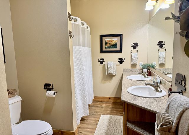 Guest bathroom with tub and shower in Condo B-8