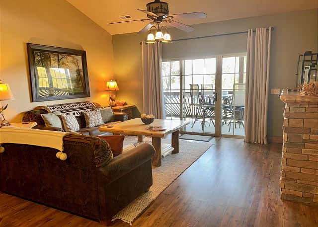 Open-concept living and dining room in Condo B-8