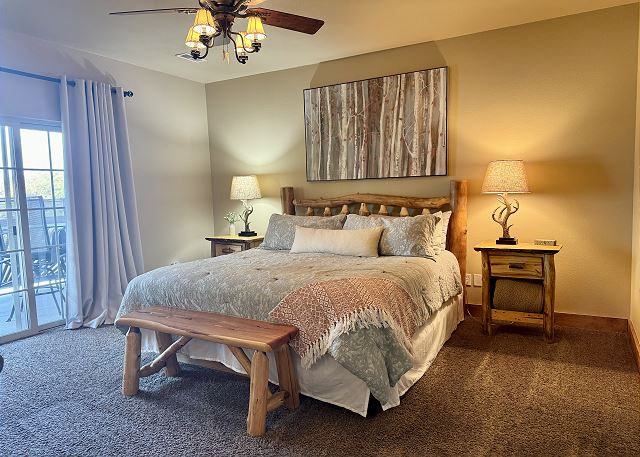 Primary king bedroom with deck access in Condo B-8