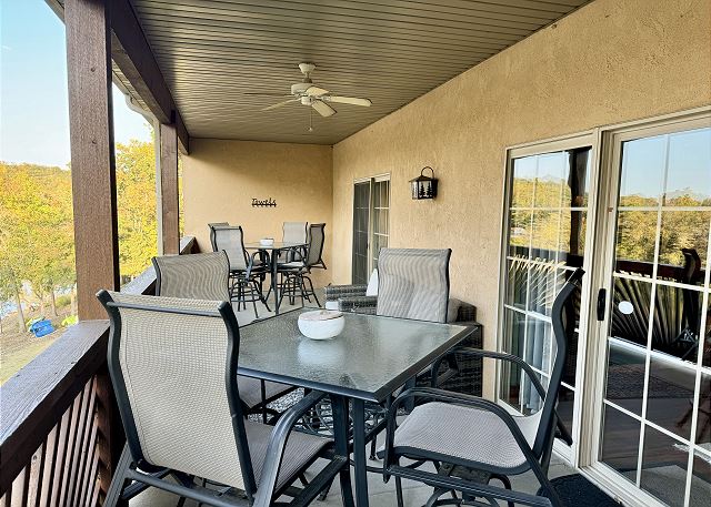 Covered deck dining and seating at Condo B-8